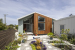 Exterior featuring timber elements and painted with Resene Blue Smoke and Resene Titania