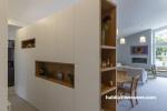 Open plan space with room divider featuring Resene Emerge