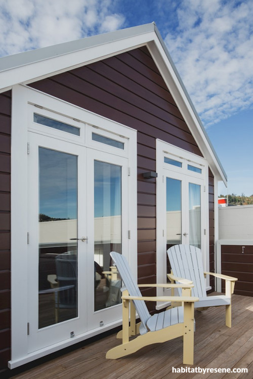 house exterior, brown house, brown exterior, deck, outdoor living, white doors