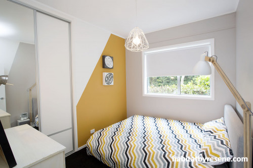 bedroom, orange bedroom, orange paint, feature wall, geometric pattern, white bedroom