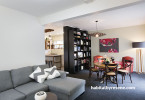 living room, lounge, dining room, black carpet, white paint, green feature wall, upcylcled bookshelf