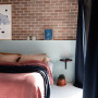 bedroom, feature wall, brick feature wall, brick interior, white bedroom, dusky pink
